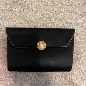 Yves Saint Laurent Black and Gold Clutch Timeless Elegance